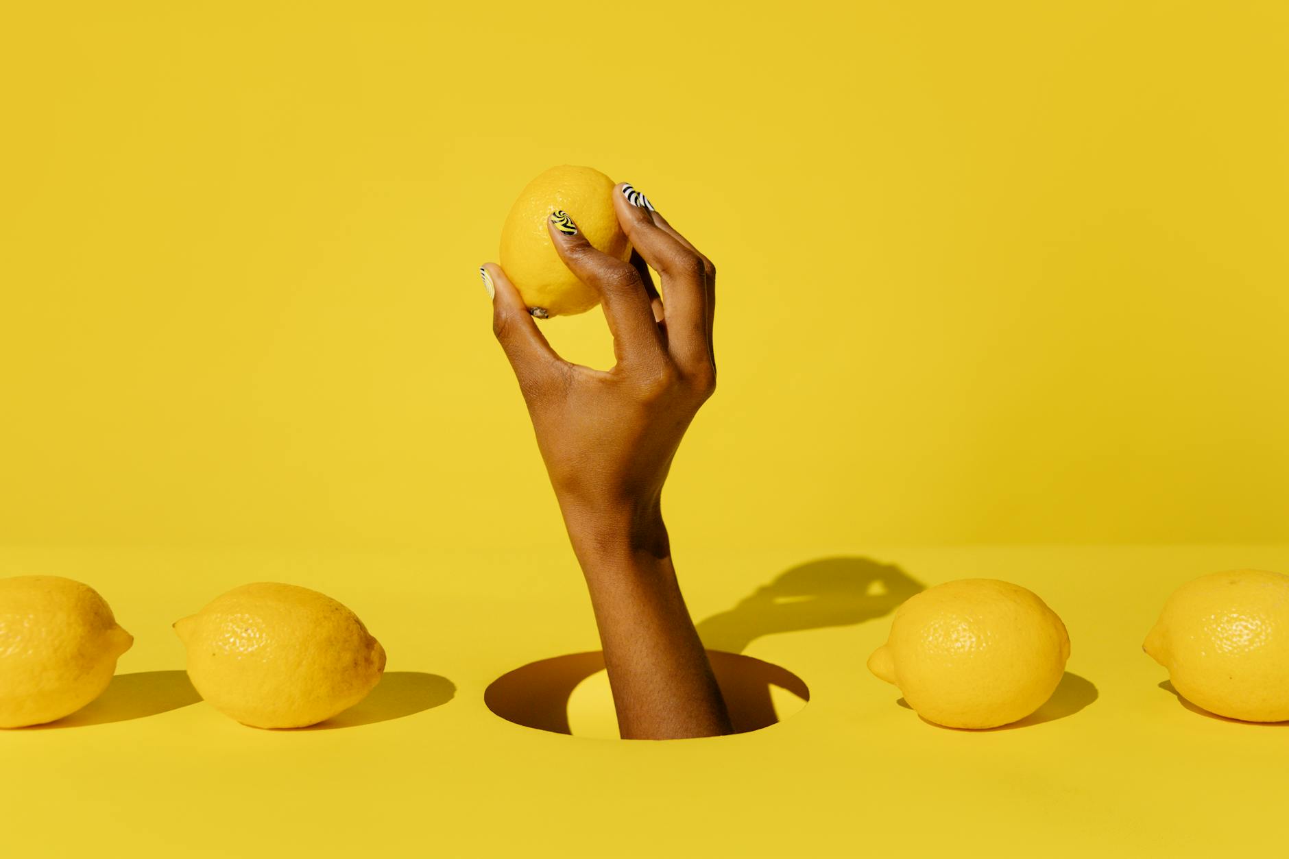 A yellow silicone vibrator surrounded by fresh bananas on a bright yellow background, symbolizing pleasure and playfulness