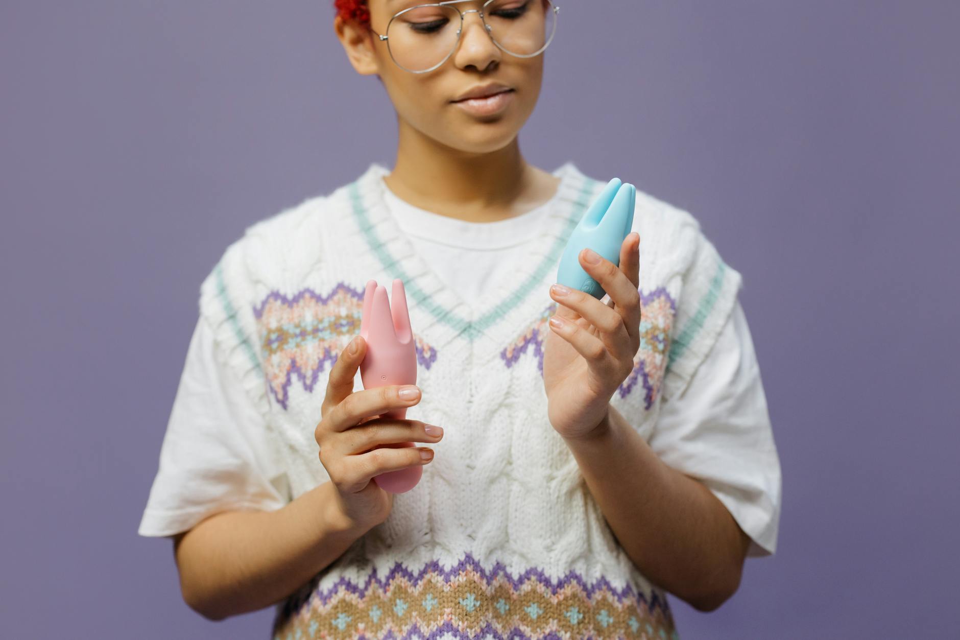 Woman holding a clitoral vibrator with confidence and ease